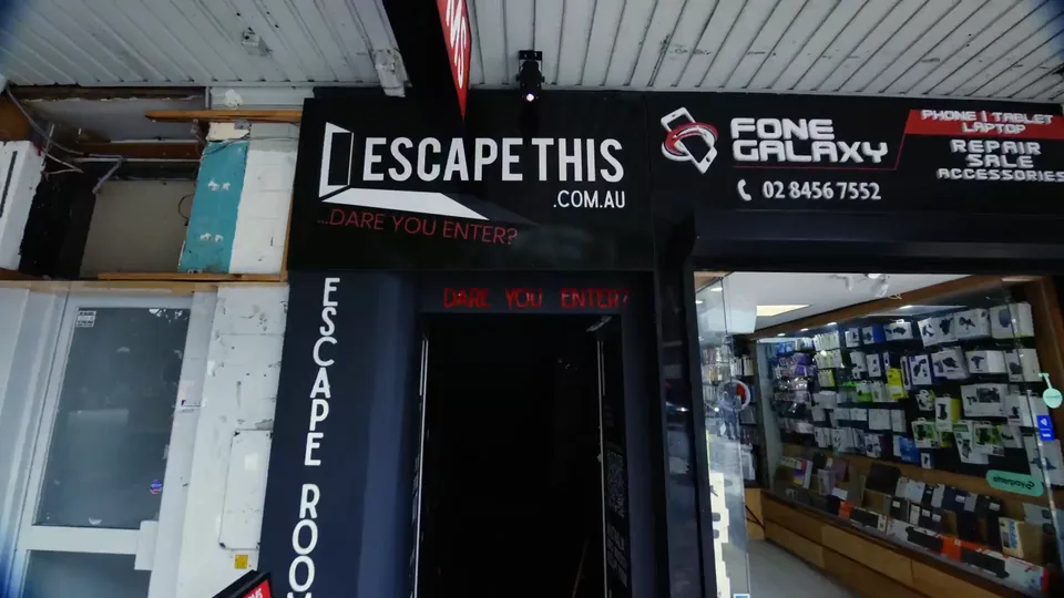 The Escape This sign above the entrance at 2B The Corso, opposite Manly Wharf